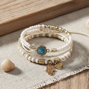 Elegant guldarmbåndssæt med hamsa