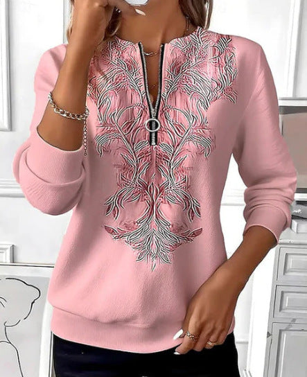 Elina – Sweatshirt med lynlås og gyldent ornamentmønster