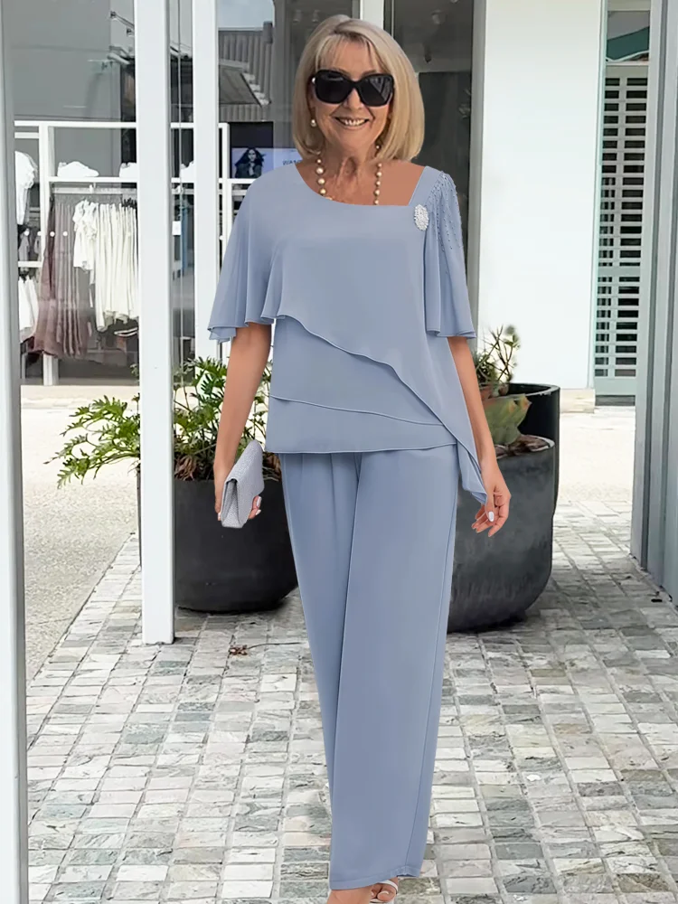 Ninon | Sæt med asymmetrisk lagdelt bluse og bukser med vide ben