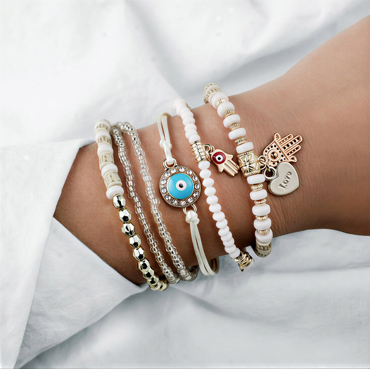 Elegant guldarmbåndssæt med hamsa